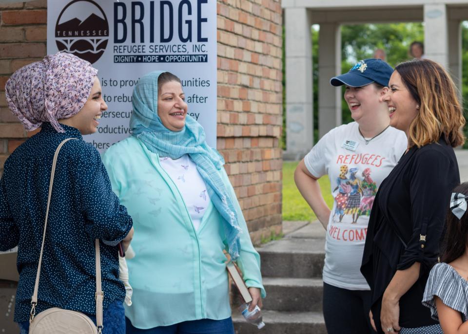 Refugees and Bridge Refugee Services staffers enjoy each others’ company at World Refugee Day, June 23, 2018.