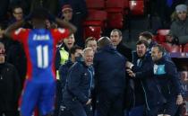 Britain Football Soccer - Crystal Palace v Swansea City - Premier League - Selhurst Park - 3/1/17 New Swansea City manager Paul Clement and caretaker manager Alan Curtis celebrate after Angel Rangel (not pictured) scores their second goal as Crystal Palace's Wilfried Zaha looks dejected Reuters / Eddie Keogh Livepic