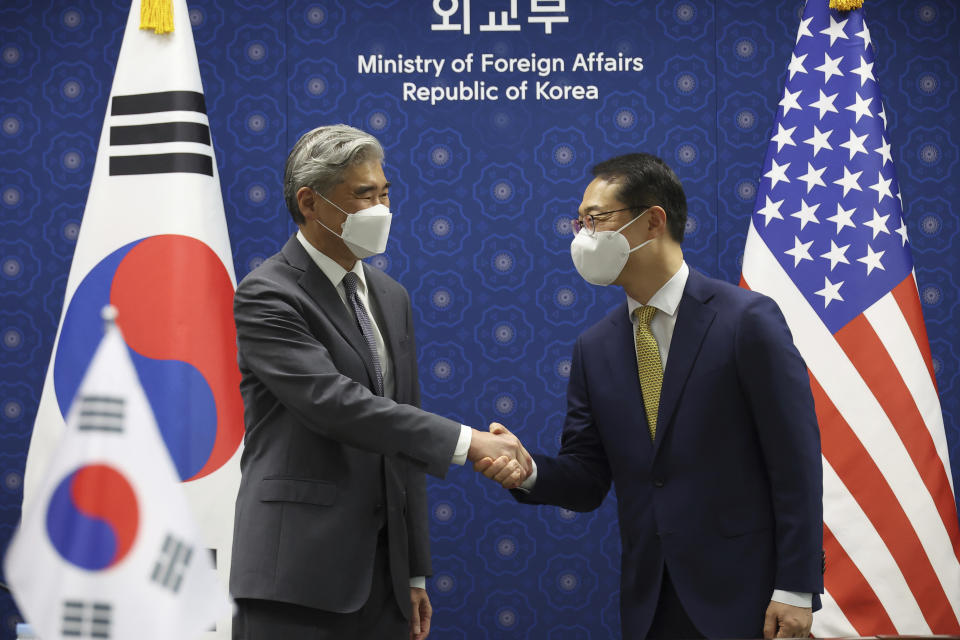 Kim Gunn, right, South Korea's new special representative for Korean Peninsula peace and security affairs and his U.S. counterpart Sung Kim pose for photographs during their meeting at the Foreign Ministry in Seoul, South Korea Friday, June 3, 2022. (Kim Hong-ji/Pool Photo via AP)