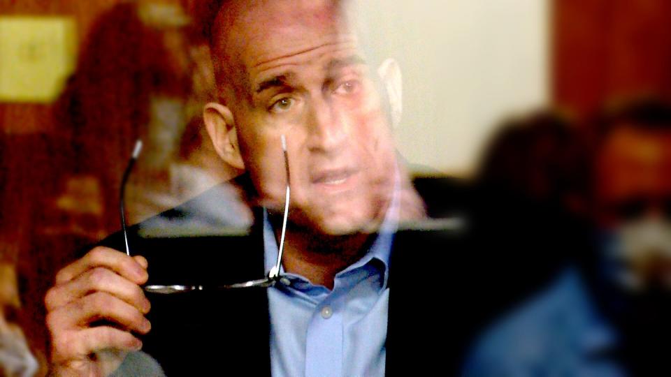 Dr. Elliot Goodman, the Jersey Shore University Medial Center emergency room doctor who treated Monique Moore after her arrest, testifies behind sheets of plexiglass during her trial Tuesday, March 15, 2022, in State Superior Court in Freehold.   Moore is on trial before Judge Jill O'Malley for the 2016 stabbing murder in Neptune of Joseph Wilson, Jr.