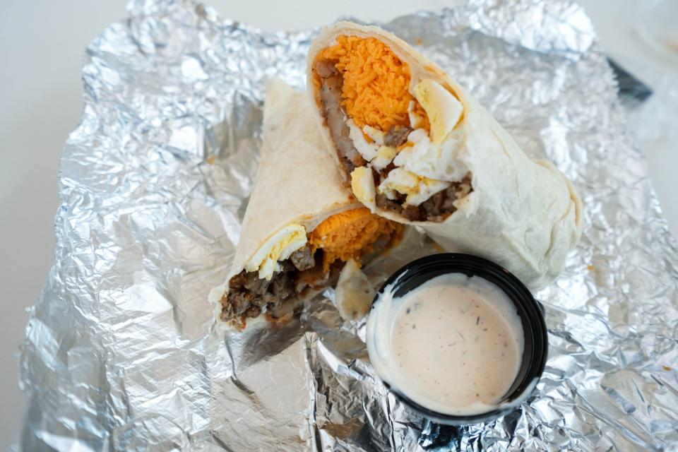 The Breakfast Burrito features eggs, hand-shredded cheese and either sausage or bacon with jalapeño ranch.