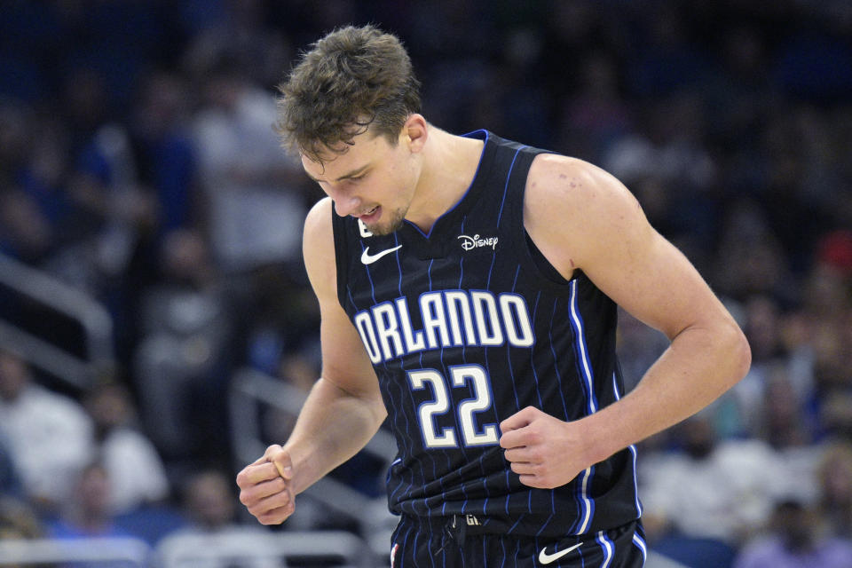 Orlando Magic forward Franz Wagner (22) reacts after scoring during the second half of an NBA basketball game against the Charlotte Hornets, Friday, Oct. 28, 2022, in Orlando, Fla. (AP Photo/Phelan M. Ebenhack)