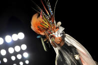 A model wears a design from the Philip Treacy Spring/Summer 2013 collection during London Fashion Week, Sunday, Sept. 16, 2012. (AP Photo/Jonathan Short)