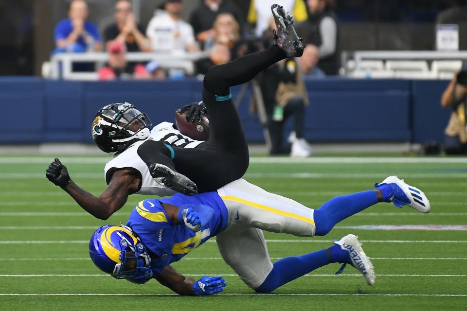 Dec 5, 2021; Inglewood, California, USA;  Los Angeles Rams safety Jordan Fuller (4) stops Jacksonville Jaguars wide receiver Laquon Treadwell (18) in the first quarter at SoFi Stadium. Mandatory Credit: Richard Mackson-USA TODAY Sports