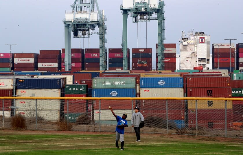 LOS ANGELES, CALIF. - NOV. 18, 2021. Kids play on a Little League baseball field that ocverlooks the Port of Los Angeles in San Pedro. (Luis Sinco / Los Angeles Times)