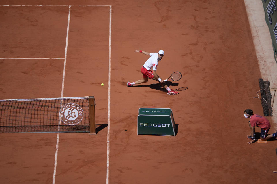 Serbia's Novak Djokovic returns the ball to Stefanos Tsitsipas of Greece during their final match of the French Open tennis tournament at the Roland Garros stadium Sunday, June 13, 2021 in Paris. (AP Photo/Christophe Ena)