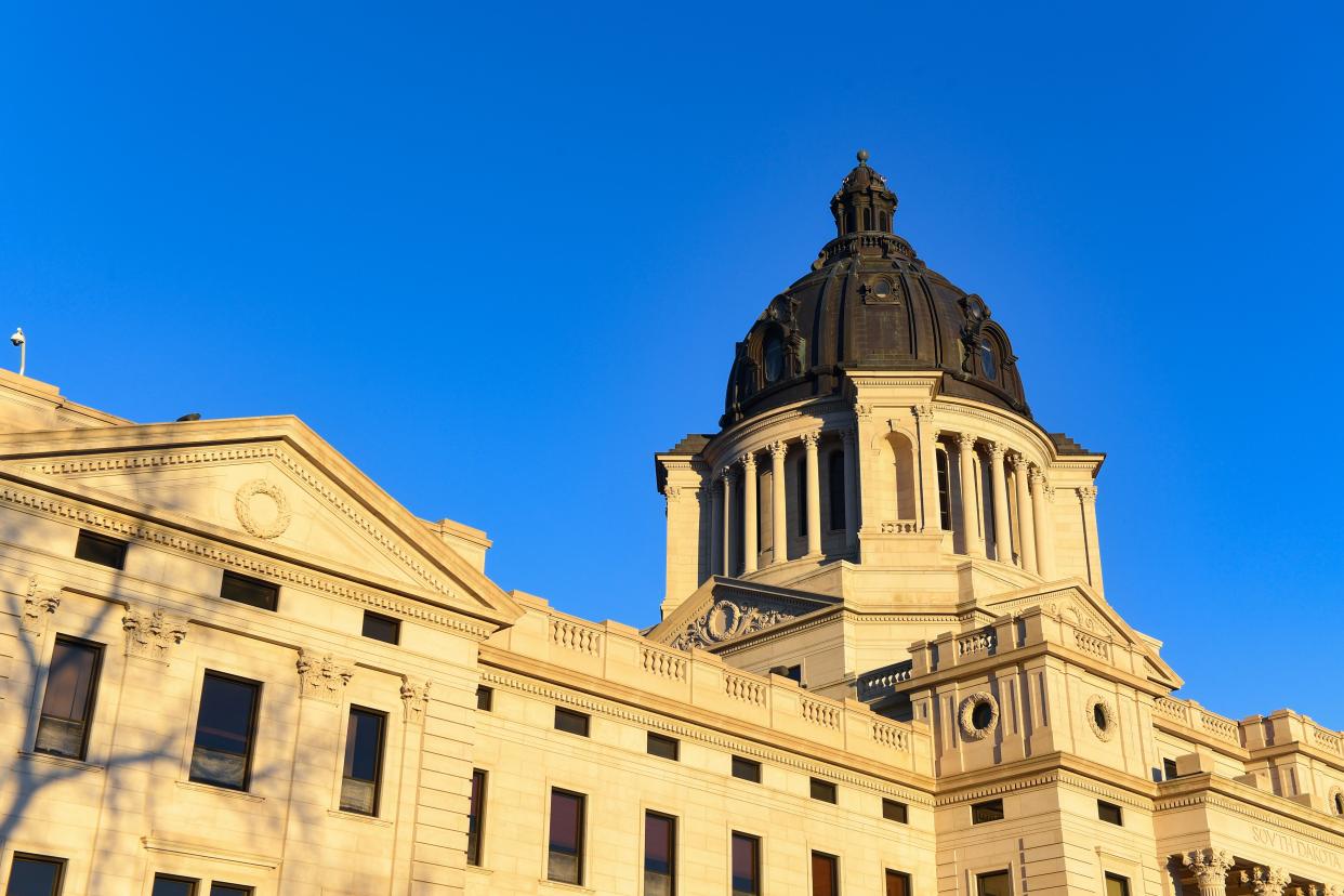 Sun sets on the South Dakota State Capitol on Monday, January 11, in Pierre.