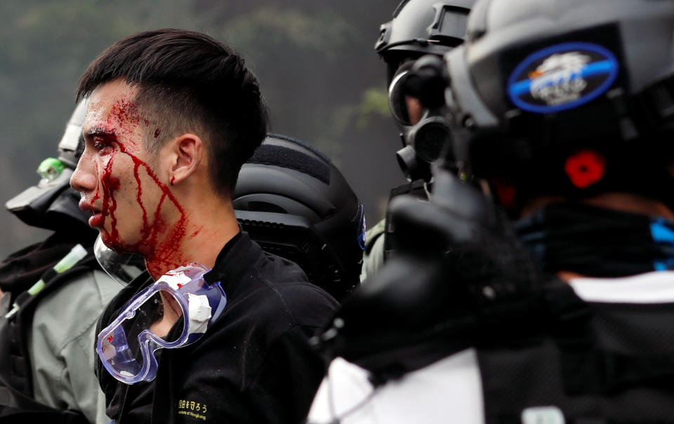 Police detain protesters who attempt to leave the campus of Hong Kong Polytechnic University (PolyU) during clashes with police in Hong Kong, China Nov. 18, 2019. (Photo: Tyrone Siu/Reuters)