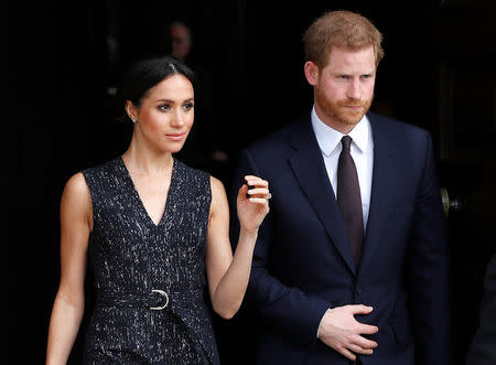 Britain's Prince Harry and his fiancee Meghan Markle leave a service at St Martin-in-The Fields to mark 25 years since Stephen Lawrence was killed in a racially motivated attack, in London, Britain, April 23, 2018. REUTERS/Peter Nicholls