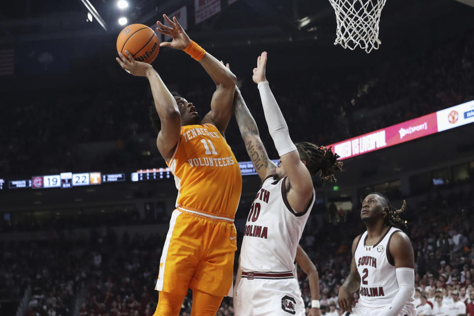 Tennessee forward Tobe Awaka (11) shoots against South Carolina guard Myles Stute (10) during the first half of an NCAA college basketball game Wednesday, March 6, 2024, in Columbia, S.C. (AP Photo/Artie Walker Jr.)