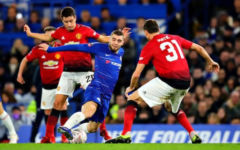 Mateo Kovacic of Chelsea is challenged by Ander Herrera (L) and Nemanja Matic both of Manchester United during the FA Cup Fifth Round match between Chelsea and Manchester United at Stamford Bridge - Credit: Getty images