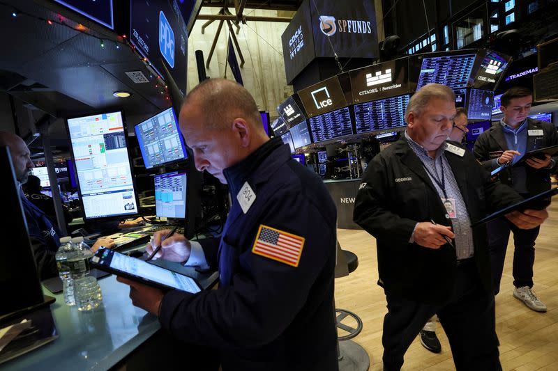 Traders work on the floor of the NYSE in New York