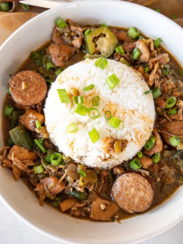 <p>Razzle Dazzle Life</p><p>Chicken and Sausage Gumbo is a hearty bowl of comfort with juicy pieces of chicken, andouille sausage, and veggies swimming in homemade roux. You will definitely want seconds of this classic southern dish served with a scoop of white rice!</p><p><strong>Get the recipe: <a href="https://www.razzledazzlelife.com/chicken-and-sausage-gumbo/" rel="nofollow noopener" target="_blank" data-ylk="slk:Chicken and Sausage Gumbo;elm:context_link;itc:0;sec:content-canvas" class="link ">Chicken and Sausage Gumbo</a></strong></p>