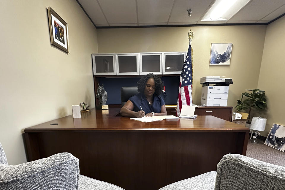 Louisiana Democratic state Rep. Delisha Boyd works at her desk at her office May 3, 2024, in New Orleans. As Boyd faces an uphill battle in Louisiana, as she attempts to advance a bill that would add cases of rape and incest as exceptions to Louisiana's near total abortion ban, the Democrat opens opening up about her mother's harrowing story and how it effected them. (AP Photo/Stephen Smith)