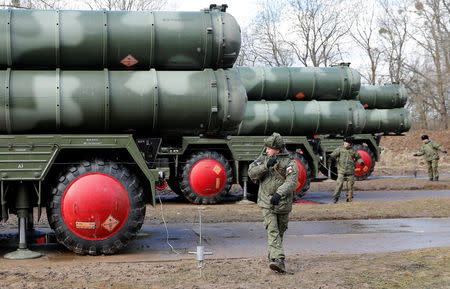 FILE PHOTO: Russian servicemen stand next to a new S-400 "Triumph" surface-to-air missile system after its deployment at a military base outside the town of Gvardeysk near Kaliningrad, Russia March 11, 2019. REUTERS/Vitaly Nevar/File Photo