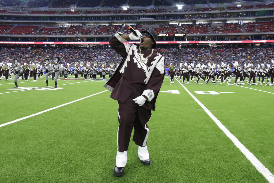 A band member raps "It's Tricky" by Run-DMC as the Texas Southern University Ocean of Soul marching band performs during the 2023 National Battle of the Bands, a showcase for HBCU marching bands, held at NRG Stadium, Saturday, Aug. 26, 2023, in Houston. (AP Photo/Michael Wyke)