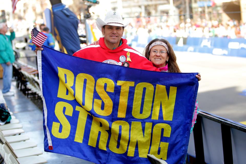 Carlos Arredondo and Melida Arredondo pose near the finish line during the 120th Boston Marathon on April 18, 2016.