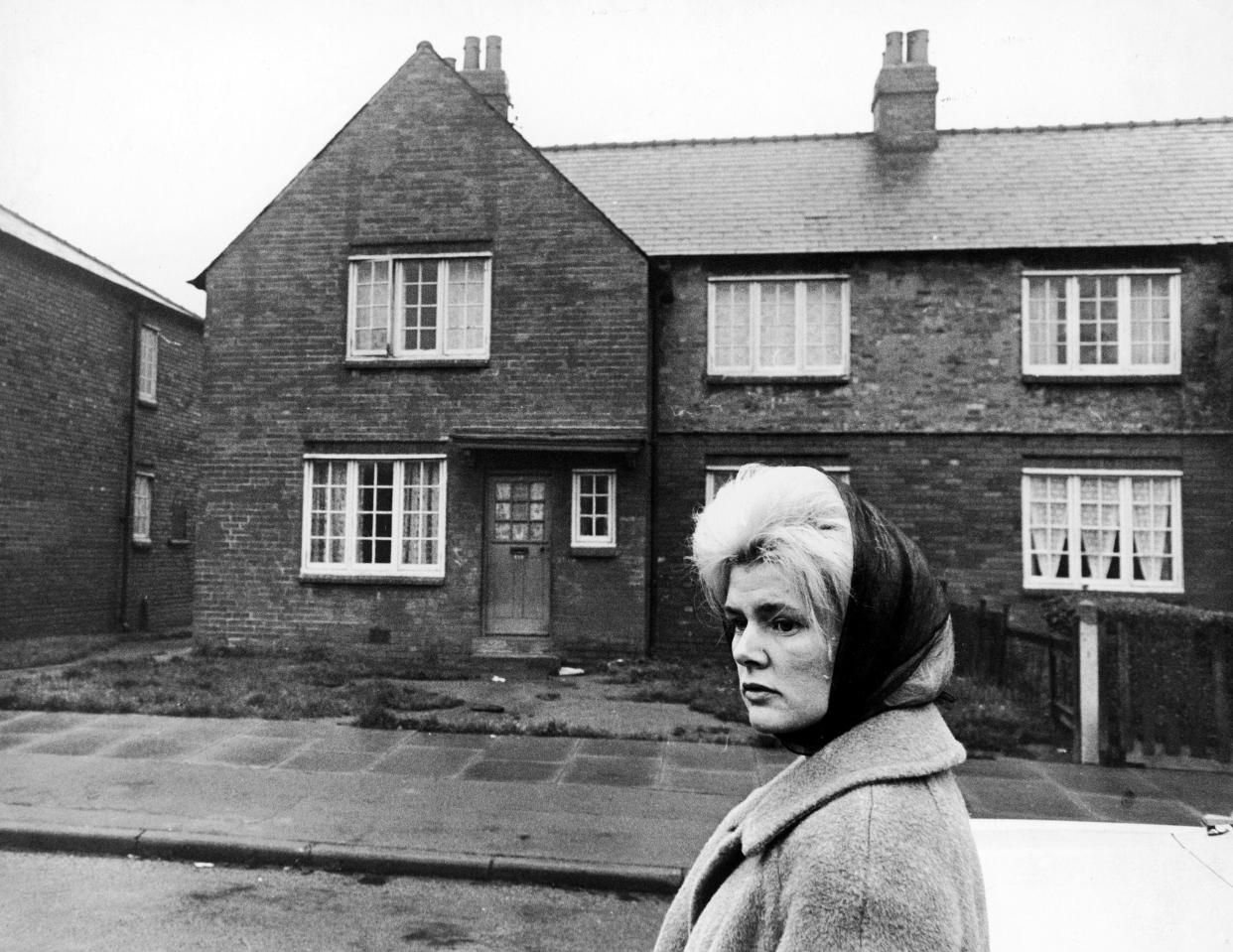 The first big winner on the Football Pools, Viv Nicholson, returns to the street where she lived before striking it rich. Her 38-shilling-a-week council house is behind her.  (Photo by S&G/PA Images via Getty Images)