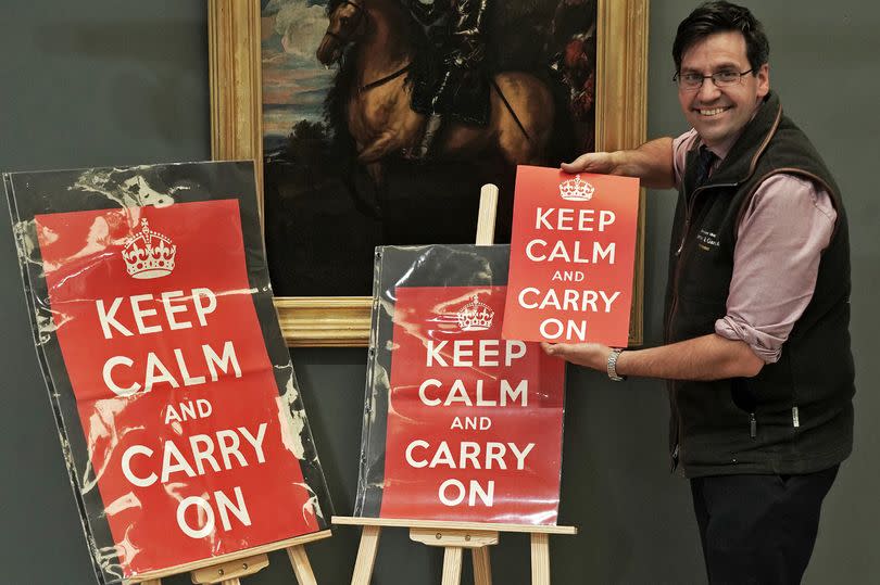 Fred Wyerley-Birch of Anderson and Garland, with three "Keep Calm, Carry On" posters that are up for auction