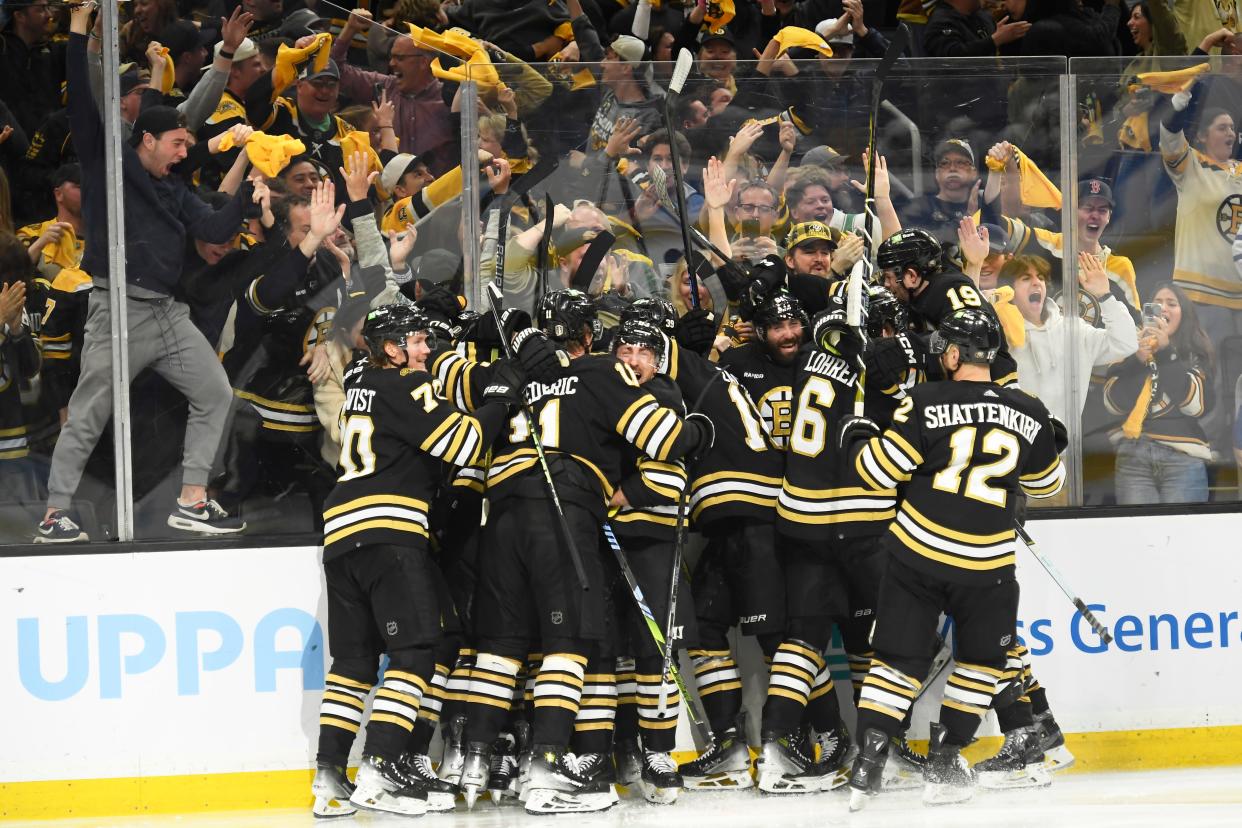 The Boston Bruins celebrate Saturday night after defeating the Toronto Maple Leafs in overtime in Game 7 of the first round of the 2024 Stanley Cup playoffs at TD Garden.