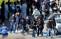 <p>Police officers and investigators are seen in front of a supermarket after a hostage situation in Trèbes, France, March 23, 2018. (Photo: Jean-Paul Pelissier/Reuters) </p>