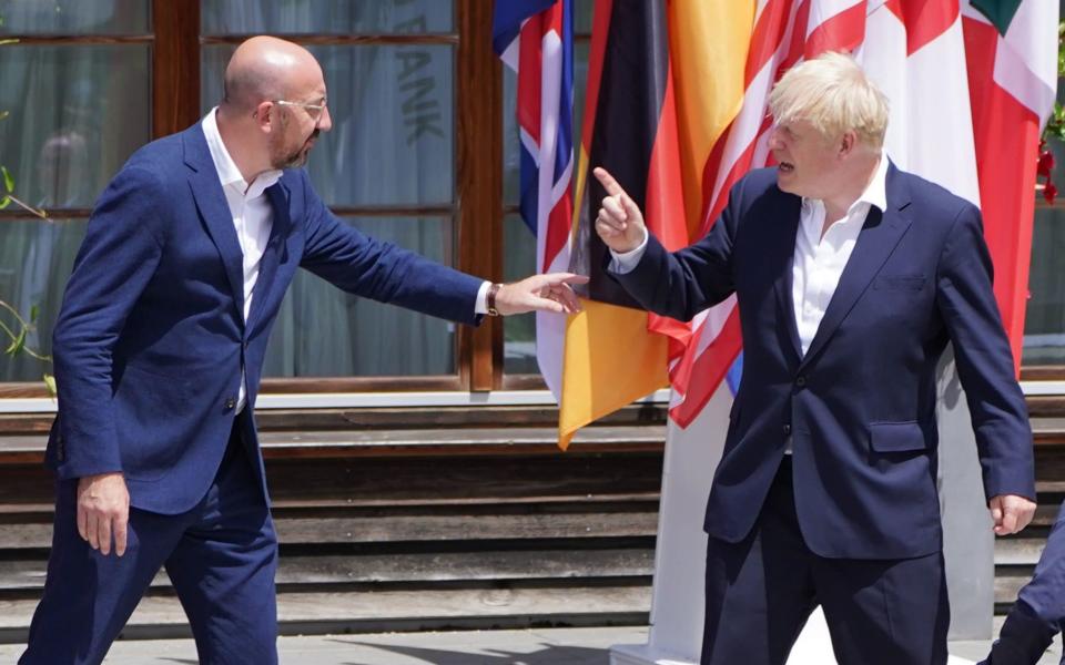 Boris Johnson speaks with Charles Michel, the President of the European Council, as G7 leaders pose for their family photograph - Stefan Rousseau/PA