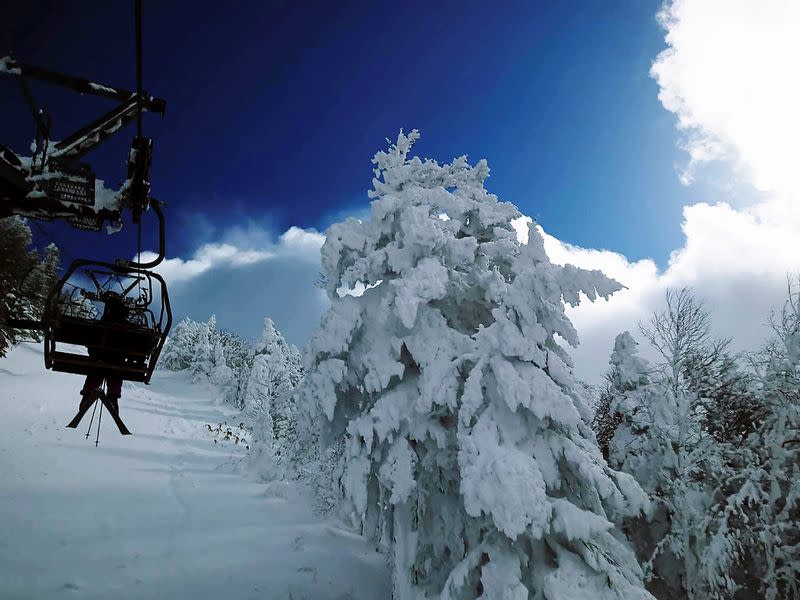 A skier rides a lift at a ski resort on Mt. Yokote in Shimotakai