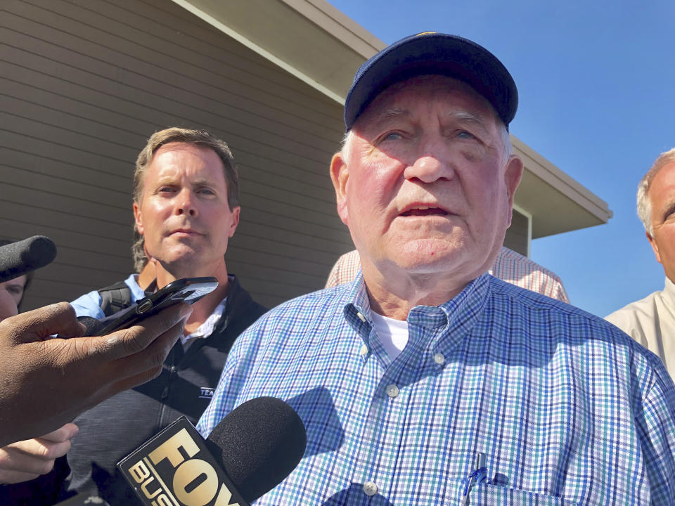 U.S. Agriculture Secretary Sonny Perdue speaks to reporters at an Ag Policy Summit during a visit Wednesday, Aug. 28, 2019 to Decatur, Ill. Perdue has sought to assuage farmers' fears of financial problems after China halted purchases of U.S. farm products in an escalating trade war. (AP Photo/John O'Connor)
