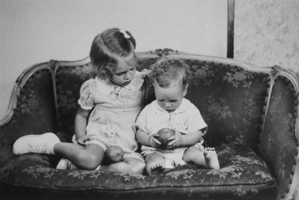 <p>Future Sen. John McCain as toddler, sits on sofa with sister Sandy in a reproduction of a family photo, circa 1938. (Photo: Terry Ashe/The LIFE Images Collection/Getty Images) </p>