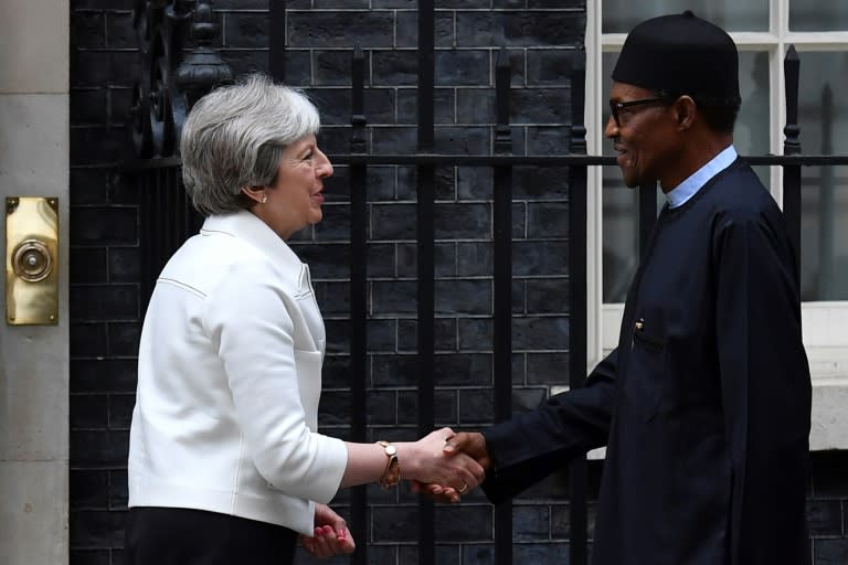 Britain's Prime Minister Theresa May (L) greets Nigeria's President Muhammadu Buhari on the steps of 10 Downing Street in London on April 16, 2018, ahead of a meeting on the sidelines of the Commonwealth Heads of Government Meeting (CHOGM)