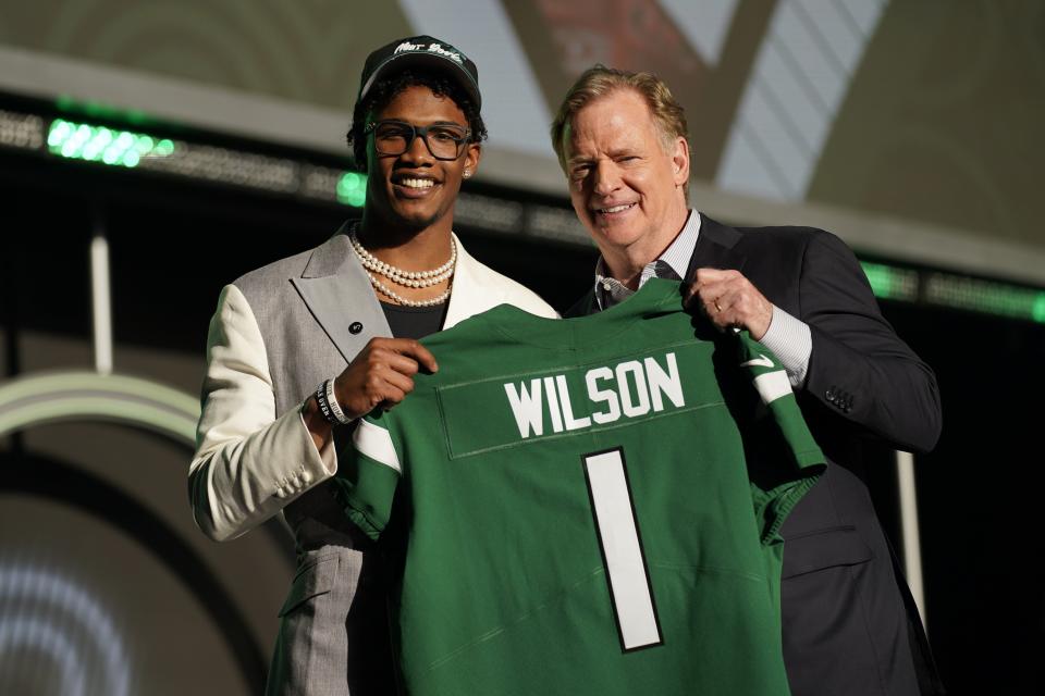 Ohio State wide receiver Garrett Wilson stands with NFL Commissioner Roger Goodell after being chosen by the New York Jets with the 10th pick of the NFL draft Thursday.