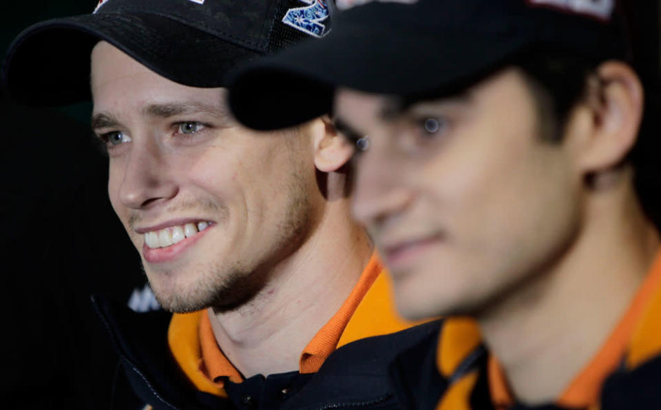 World MotoGP Champion Casey Stoner from Australia and teammate Dani Pedrosa pose for photographers during the presentation of the Repsol Honda Moto GP Team at the 'Palacio de los Deportes' in Madrid, Spain on Saturday, March 3, 2012.