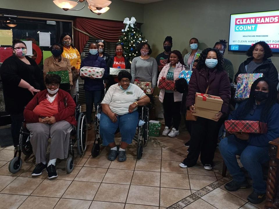 Members of Sisters With Aspiring Goals donated shoebox-filled Christmas presents to residents at the Forest Cove Nursing Home.