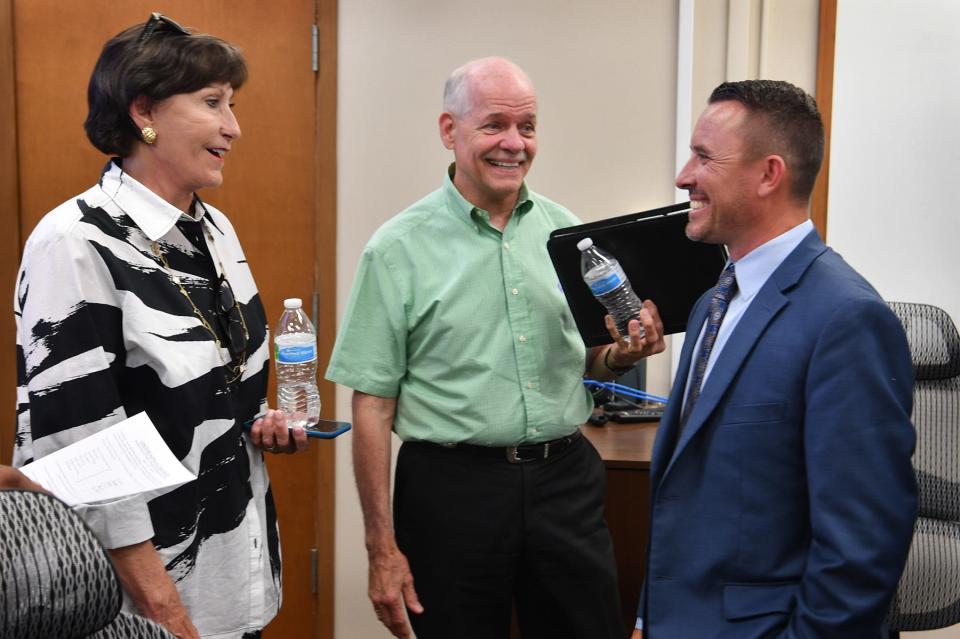 Dr. Donny Lee, sole finalist for WFISD superintendent, visits with school board members Kathryn McGregor and Mark Lukert following Monday afternoon's announcement.