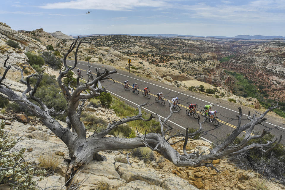 FILE - In this Aug. 2, 2016, file photo, cyclists race along the scenic Byway 12 above the Grand Staircase-Escalante National Monument during the Tour Of Utah bike race. President Joe Biden said Wednesday, Jan. 20, 2021, he plans to review the Trump administration's downsizing of the Grand Staircase-Escalante and Bears Ears National Monuments in southern Utah. (Francisco Kjolseth/The Salt Lake Tribune via AP, File)