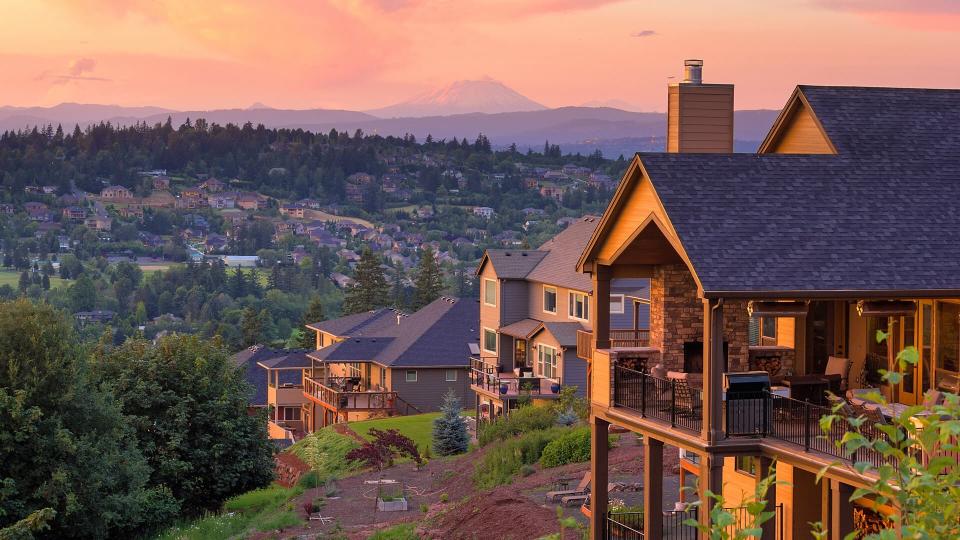 Sunset View with Mount St Helens from deck of luxury homes in Happy Valley Oregon in Clackamas County.