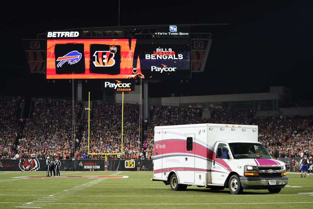 FILE - An ambulance leaves the field with Buffalo Bills' Damar Hamlin during the first half of an NFL football game between the Bills and the Cincinnati Bengals, Monday, Jan. 2, 2023, in Cincinnati. On Friday, Jan. 20, The Associated Press reported on stories circulating online incorrectly claiming an image shows that CNN published a Jan. 11 headline reading, “Doctor of Damar Hamlin confirms Cardiac Arrest was due to the 4th Booster Vaccine.”(AP Photo/Joshua A. Bickel, file)