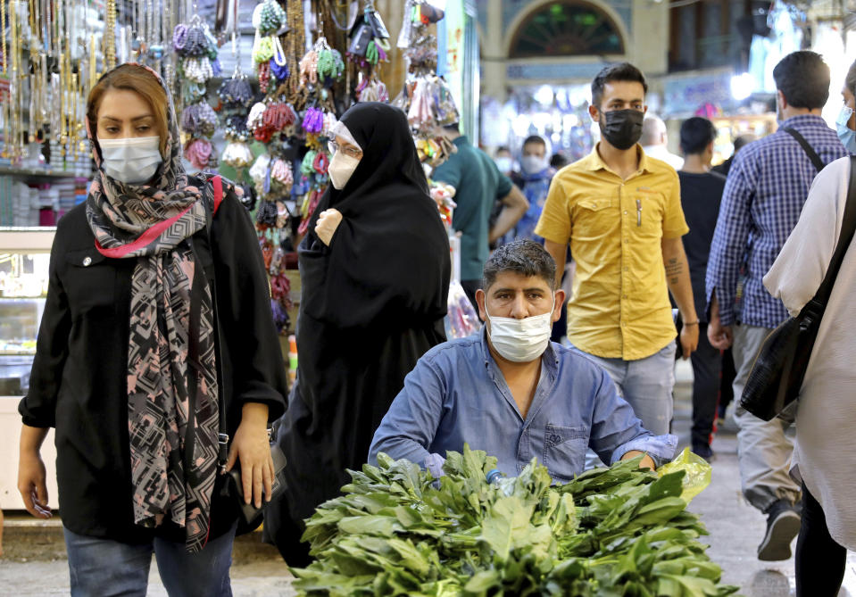 FILE - A vendor waits for customers in the Tajrish traditional bazaar in northern Tehran, Iran, Sept. 25, 2021. Sweeping U.S. sanctions imposed on Iran have badly impacted the country’s economy and worsened the humanitarian situation in the Persian Gulf nation, Alena Douha, a United Nations special envoy, said Wednesday, May 18, 2022. (AP Photo/Ebrahim Noroozi, File)