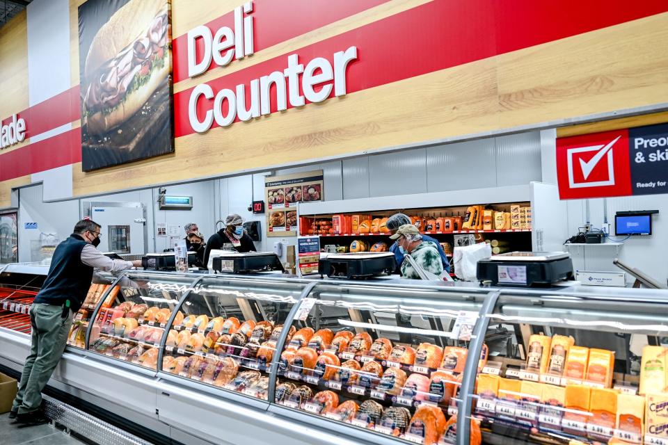 Employees ready the deli counter at BJ's Wholesale Club on Wednesday, Jan. 26, 2022, in Delta Township.