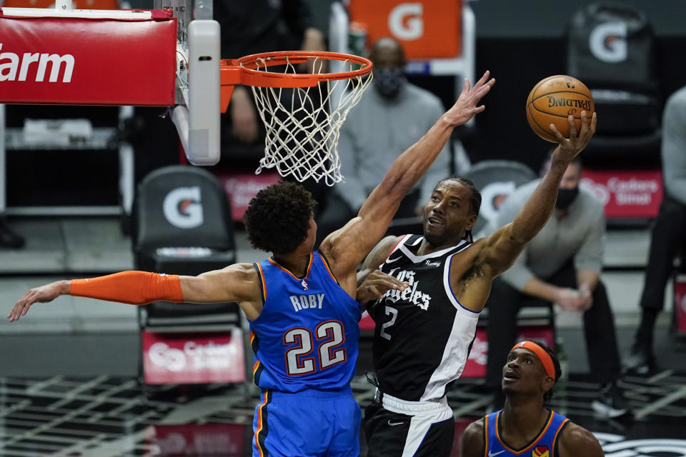 Los Angeles Clippers forward Kawhi Leonard (2) takes a shot against Oklahoma City Thunder forward Isaiah Roby (22) during the first quarter of an NBA basketball game Sunday, Jan. 24, 2021, in Los Angeles. (AP Photo/Ashley Landis)