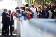 Brazil's President Jair Bolsonaro meets supporters as he leaves Alvorada Palace, amid coronavirus disease (COVID-19) outbreak, in Brasilia