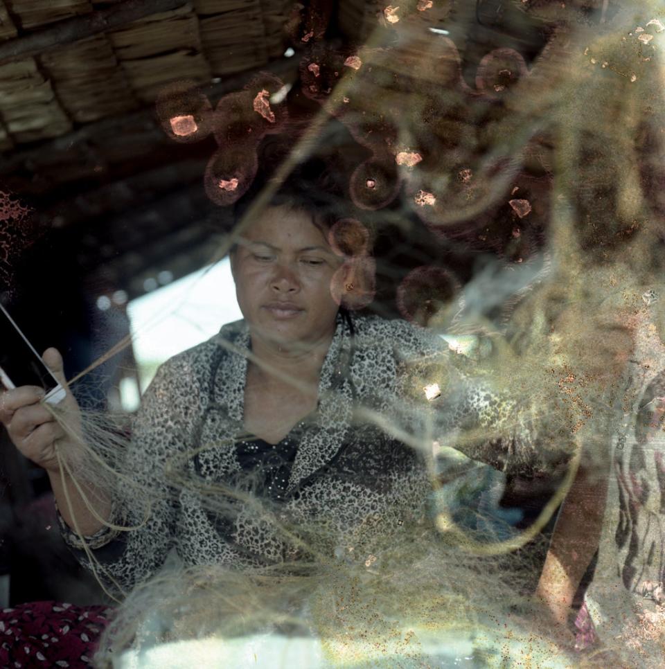 The family earn around £3.50 per day from selling the fish they catch from the lake (Lim Sokchanlina/Save the Children)