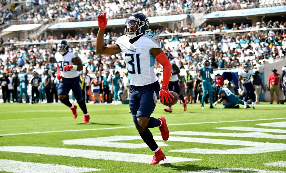 Tennessee Titans free safety Kevin Byard (31) scores a touchdown after recovering a fumble during the first quarter of the game at TIAA Bank Field Sunday, Oct. 10, 2021 in Jacksonville, Fla. 