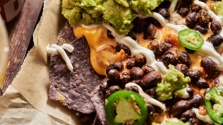 nachos with guacamole and beans