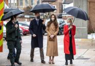 <p>The Duchess of Cambridge opted for a monochromatic look for <a href="https://www.townandcountrymag.com/society/tradition/a35874683/kate-middleton-camel-coat-newham-ambulance-station-photos/" rel="nofollow noopener" target="_blank" data-ylk="slk:a visit with first responders;elm:context_link;itc:0;sec:content-canvas" class="link ">a visit with first responders</a> at an ambulance station in London. She paired her camel ensemble with a floral face mask and suede camel heels to match her clutch.</p>