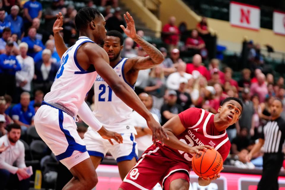 Oklahoma Sooners guard Grant Sherfield (25) dribbles past Seton Hall Pirates forward KC Ndefo (13) during the first half at ESPN Wide World of Sports.