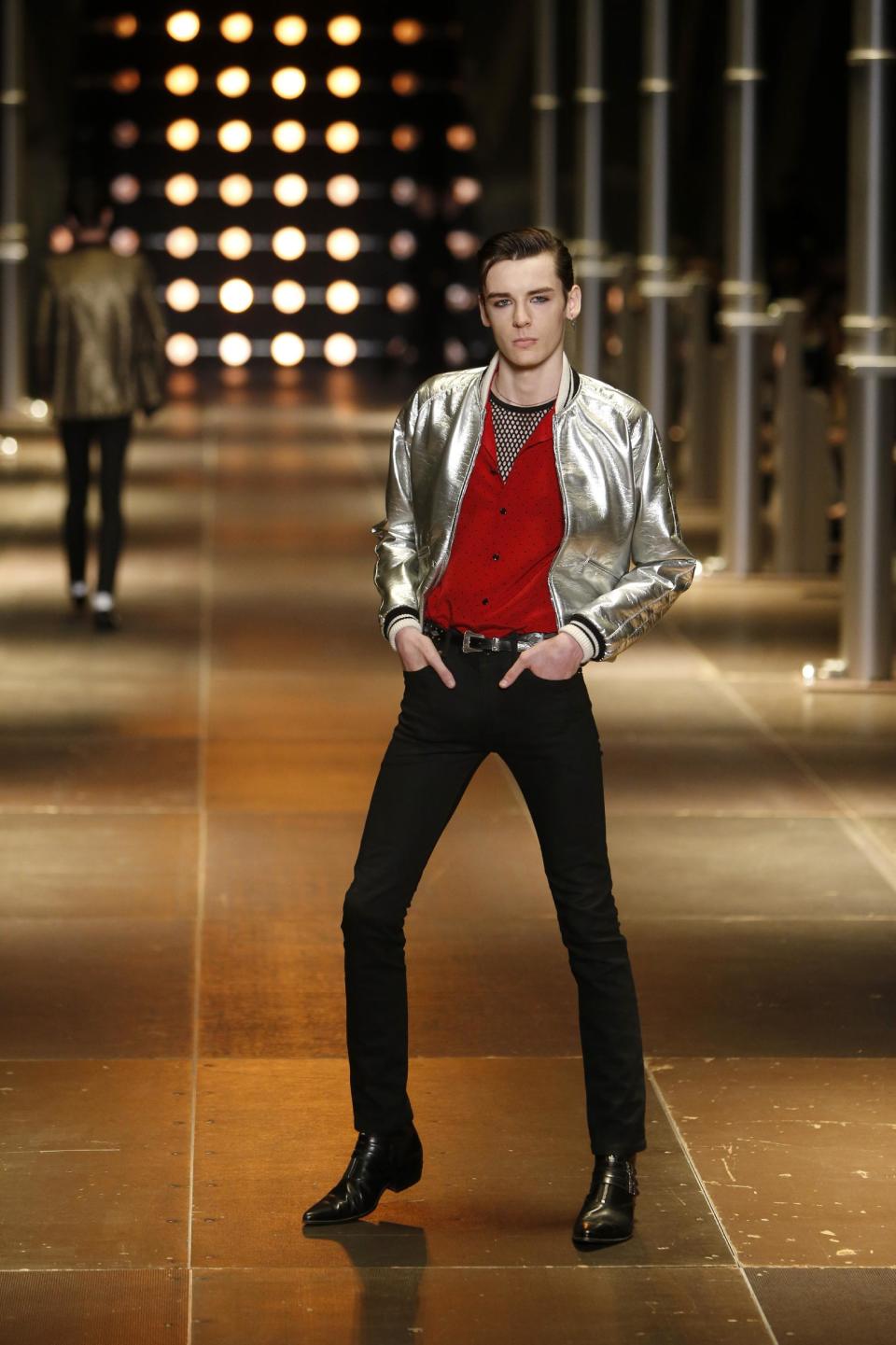 A model presents a creation as part of Yves Saint Laurent's men's fashion Spring-Summer 2014 collection, presented Sunday, June 30, 2013 in Paris. (AP Photo/Francois Mori)