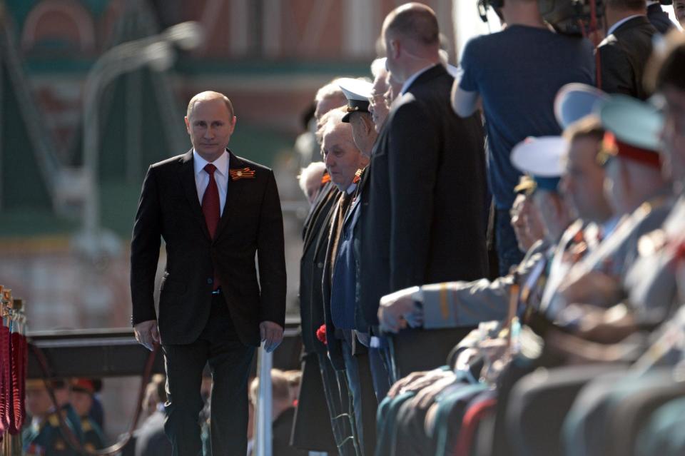 Russian President Vladimir Putin arrives to attend a Victory Day parade, which commemorates the 1945 defeat of Nazi Germany, in Moscow, Russia, Friday, May 9, 2014. Russia marked the Victory Day on May 9 holding a military parade at Red Square. (AP Photo/RIA-Novosti, Alexei Nikolsky, Presidential Press Service)