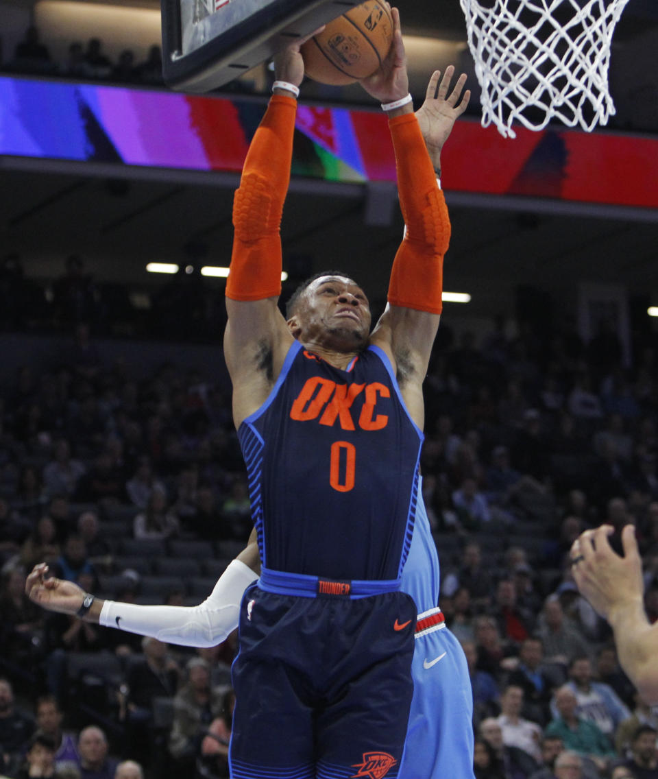 Oklahoma City Thunder guard Russell Westbrook (0) drives to the basket against the Sacramento Kings during the first half of an NBA basketball game in Sacramento, Calif., Wednesday, Dec. 19, 2018. (AP Photo/Steve Yeater)