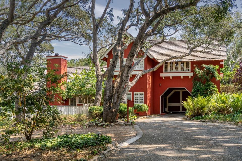 The home's red gate house has two full apartments for property caretakers.